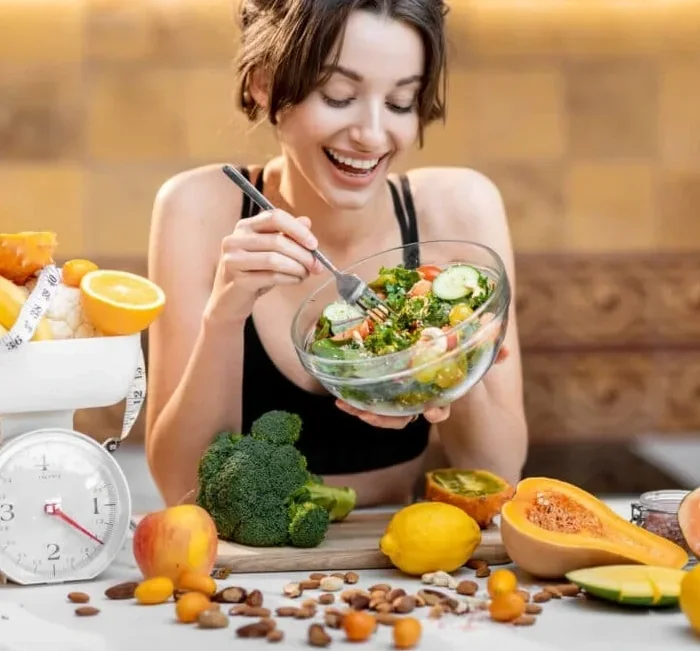 A bowl of salad with vegetables on a table